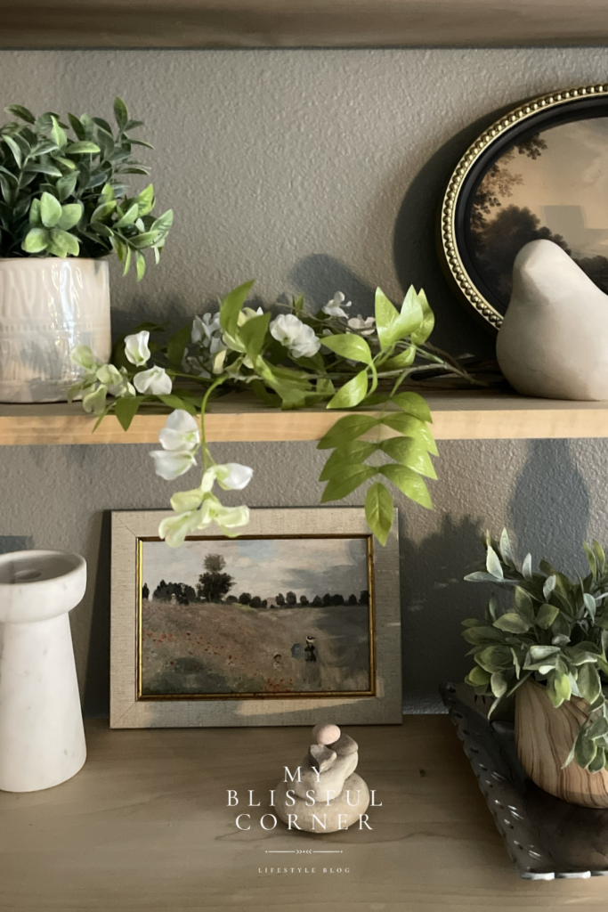 shelf decor living room with wood floating shelves styled with greenery and neutral accents.