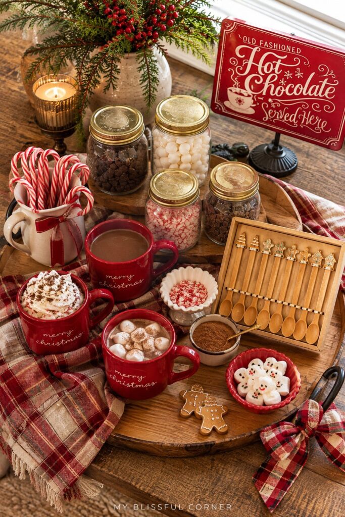 Hot cocoa bar toppings in jars and bowls, including marshmallows, peppermint, and chocolate chips