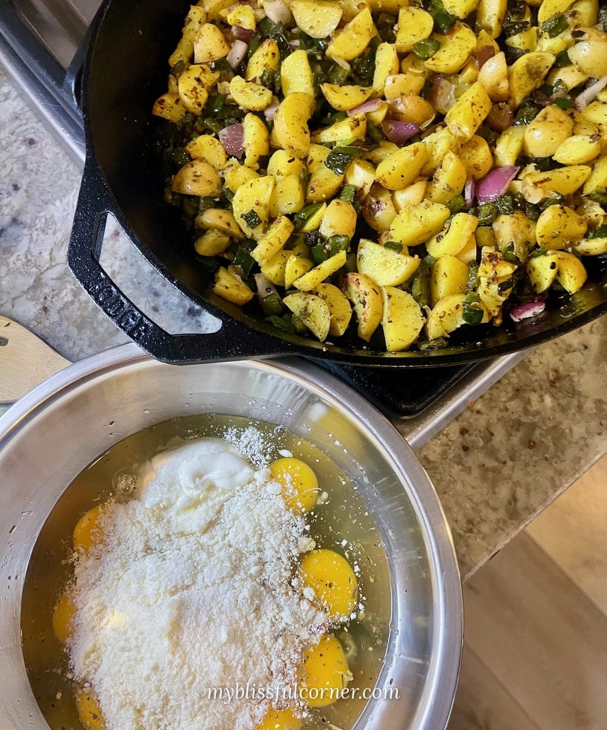 potatoes and poblanos in cast iron skillet with egg mixture for egg bake